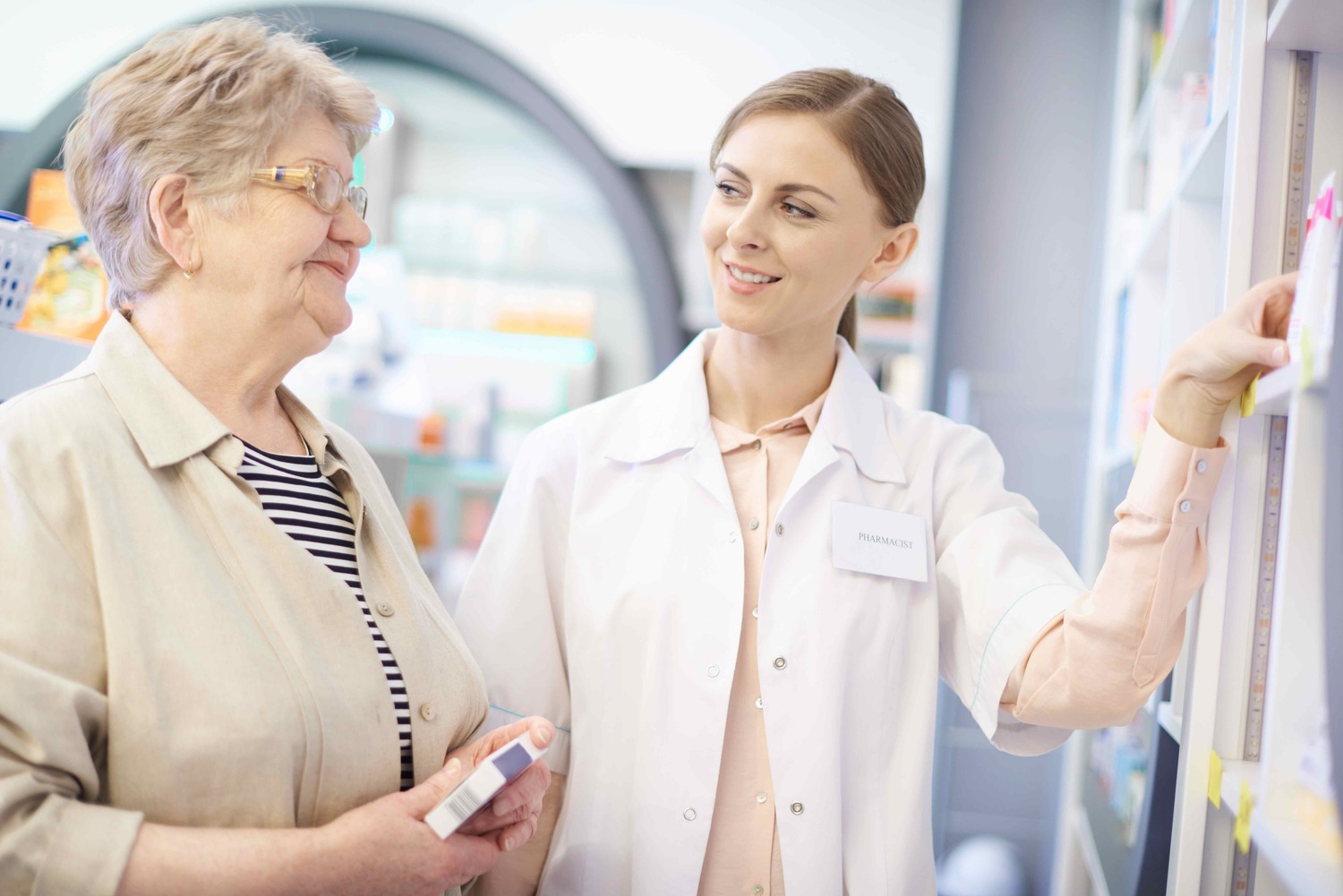 Pharmacist talking with patient